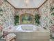 Bathroom with a large jetted tub and a window view at 655 Mcdonough Rd, Hampton, GA 30228