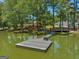 Floating dock extending into lake, providing water access at 655 Mcdonough Rd, Hampton, GA 30228