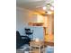 Kitchen with white cabinets, a breakfast bar, and modern appliances at 12 Intown Pl, Fayetteville, GA 30214