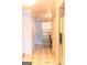 Hallway with tile flooring, leading to kitchen and dining area at 12 Intown Pl, Fayetteville, GA 30214