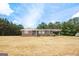 Ranch home with covered porch and yard at 409 N Green Cir, Mcdonough, GA 30252