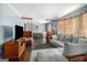 Living room with a sofa, TV and dining area at 409 N Green Cir, Mcdonough, GA 30252