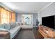 Spacious living room with sectional sofa and TV at 409 N Green Cir, Mcdonough, GA 30252
