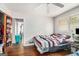 Bright bedroom with hardwood floors and a double bed at 409 N Green Cir, Mcdonough, GA 30252