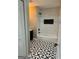 Bathroom with black and white geometric floor tiles at 1901 Maywood Nw Pl, Atlanta, GA 30318