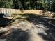 Large backyard with a gravel driveway and wooden fence at 1901 Maywood Nw Pl, Atlanta, GA 30318