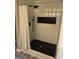 Modern bathroom with black and white hexagonal floor and shower at 1901 Maywood Nw Pl, Atlanta, GA 30318