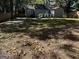 Large backyard with a mostly grassy area and wooden fence at 1901 Maywood Nw Pl, Atlanta, GA 30318