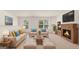 Living room with fireplace, comfortable seating, and large windows at 660 Edgar St # 158, Hampton, GA 30228