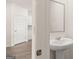 Simple bathroom with pedestal sink and mirror at 660 Edgar St # 158, Hampton, GA 30228