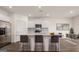 Modern kitchen with island and stainless steel appliances at 660 Edgar St # 158, Hampton, GA 30228