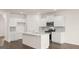 Modern kitchen featuring white cabinets, stainless steel appliances, and an island at 660 Edgar St # 158, Hampton, GA 30228