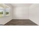 Bright living room with hardwood floors and a window at 660 Edgar St # 158, Hampton, GA 30228