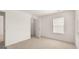 Spacious bedroom featuring a closet and a window with blinds at 660 Edgar St # 158, Hampton, GA 30228