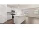 Modern kitchen with island, stainless steel appliances, and white cabinets at 660 Edgar St # 158, Hampton, GA 30228