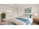 Bright bedroom with ensuite bathroom and teal accents at 660 Edgar St # 158, Hampton, GA 30228