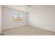 Spacious bedroom with neutral carpeting and a large window at 660 Edgar St # 158, Hampton, GA 30228