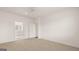 Bright bedroom with neutral carpeting and access to a bathroom at 660 Edgar St # 158, Hampton, GA 30228