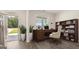 Bright home office features built-in shelving and hardwood floors at 660 Edgar St # 158, Hampton, GA 30228