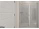 Modern bathroom with a glass shower enclosure and white tile at 660 Edgar St # 158, Hampton, GA 30228