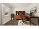 Home office with wood desk, chair, and built-in shelving at 660 Edgar St # 158, Hampton, GA 30228