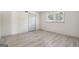 Bright bedroom with wood-look floors and ample closet space at 1785 Enid Dr, Lithonia, GA 30058