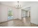 Bright dining room with hardwood floors and view to living room at 1785 Enid Dr, Lithonia, GA 30058