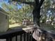 View of backyard with storage shed and large trees at 4466 Merlin Dr, Douglasville, GA 30134