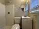 Clean bathroom with shower/tub combo, vanity, and a mirror at 4466 Merlin Dr, Douglasville, GA 30134