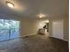 Open living space with a view into the kitchen and access to a deck at 4466 Merlin Dr, Douglasville, GA 30134