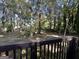 Private backyard with mature trees and a wooden fence at 4466 Merlin Dr, Douglasville, GA 30134
