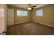 Bright bedroom featuring neutral decor, carpet, and ceiling fan at 4466 Merlin Dr, Douglasville, GA 30134
