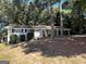 Charming ranch home with mature landscaping and a covered porch at 4466 Merlin Dr, Douglasville, GA 30134