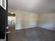 Bright living room with neutral colors, carpet, and access to a deck at 4466 Merlin Dr, Douglasville, GA 30134