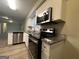 Well-equipped kitchen featuring granite countertops and stainless steel appliances at 4466 Merlin Dr, Douglasville, GA 30134