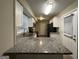 Modern kitchen with granite countertops and stainless steel appliances at 4466 Merlin Dr, Douglasville, GA 30134