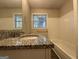 Updated bathroom with granite vanity and a bathtub at 4466 Merlin Dr, Douglasville, GA 30134
