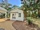 Detached white studio with double doors and gravel driveway at 1471 Centennial Rd, Rutledge, GA 30663