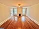 Spacious living room with hardwood floors and a fireplace at 1471 Centennial Rd, Rutledge, GA 30663