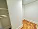 Spacious closet with built-in shelving and hardwood floors at 1471 Centennial Rd, Rutledge, GA 30663