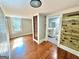Bedroom with hardwood floors, en-suite bathroom, and exposed brick at 1471 Centennial Rd, Rutledge, GA 30663