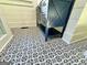 Stylish bathroom with patterned floor tile and a dark blue vanity at 1471 Centennial Rd, Rutledge, GA 30663