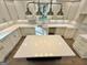 Modern kitchen with white cabinets and a farmhouse sink at 1471 Centennial Rd, Rutledge, GA 30663