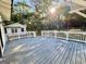 Large deck with white railings and view of the woods at 1471 Centennial Rd, Rutledge, GA 30663