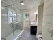 Modern bathroom with gray tile shower and patterned floor at 1471 Centennial Rd, Rutledge, GA 30663