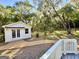 Detached studio nestled in the backyard with a tree and grassy area at 1471 Centennial Rd, Rutledge, GA 30663