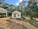 Charming white studio with French doors, surrounded by landscaping at 1471 Centennial Rd, Rutledge, GA 30663