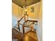 Elegant staircase leading to the upper level with hardwood floors and white railings at 1471 Centennial Rd, Rutledge, GA 30663