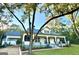 Renovated farmhouse exterior boasts a wrap-around porch and mature landscaping at 1471 Centennial Rd, Rutledge, GA 30663