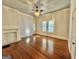 Living room with hardwood floors, fireplace, and high ceilings at 1471 Centennial Rd, Rutledge, GA 30663